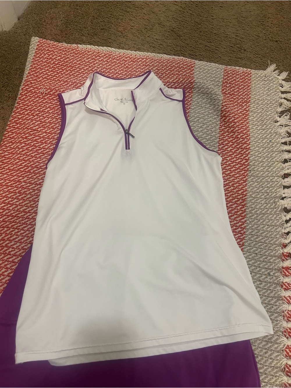 Catalina Sleeveless White Golf Polo with Purple Trim and the matching skirt.